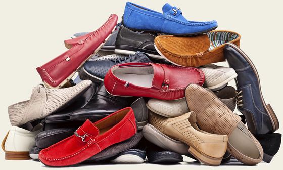 A large pile of donated shoes in many colours and styles.