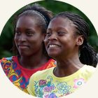 Two young women smiling outdoors